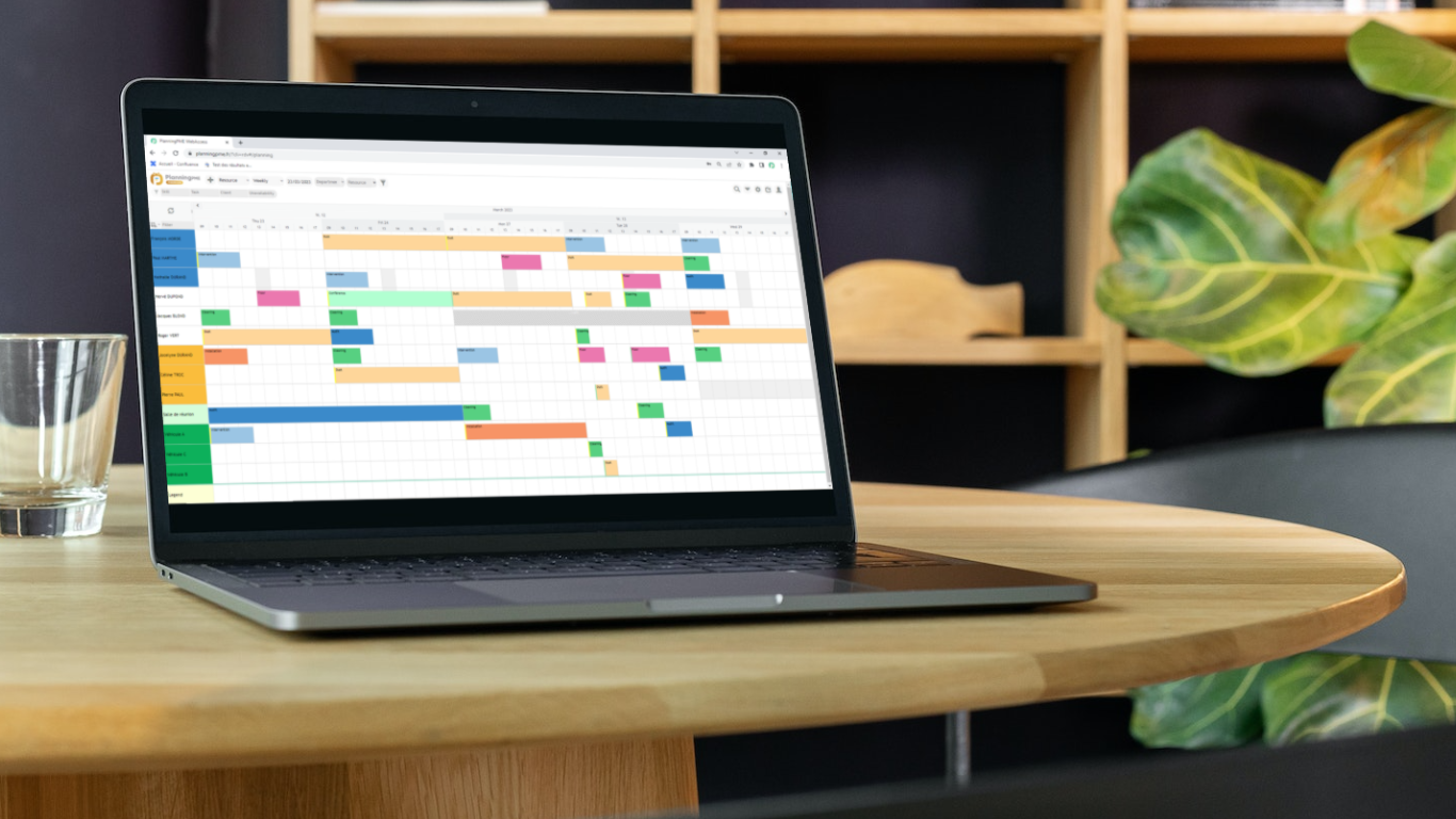 Weekly schedule displayed on a laptop in a workspace